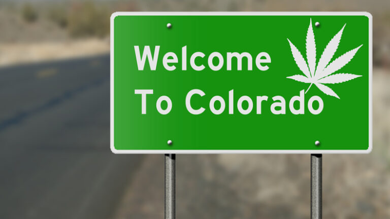 Welcome to colorado sign with a cannabis leaf
